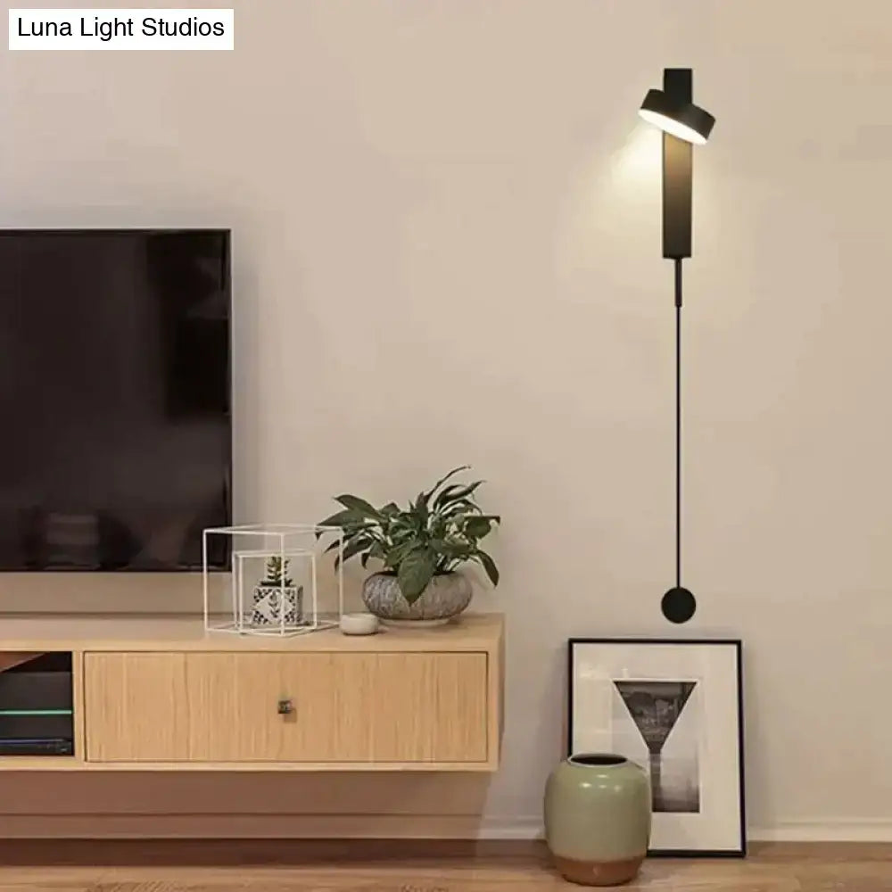 Modern black wall lamps with a sleek minimalist design and adjustable light head for bedroom use