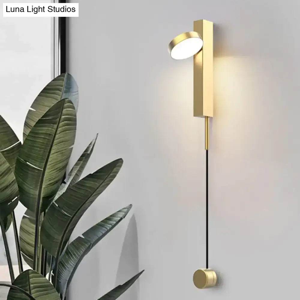 Modern gold led wall lamps with a sleek rectangular body circular light head and cylindrical base for bedroom use
