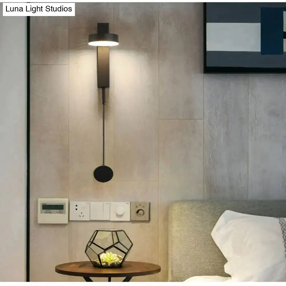 Modern black led wall lamp with sleek minimalist design and adjustable pull cord as a rotating bedroom wall lamp