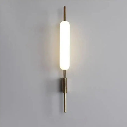 Modern gold led wall light with brass finish and frosted glass diffuser ideal for bedroom wall light illumination
