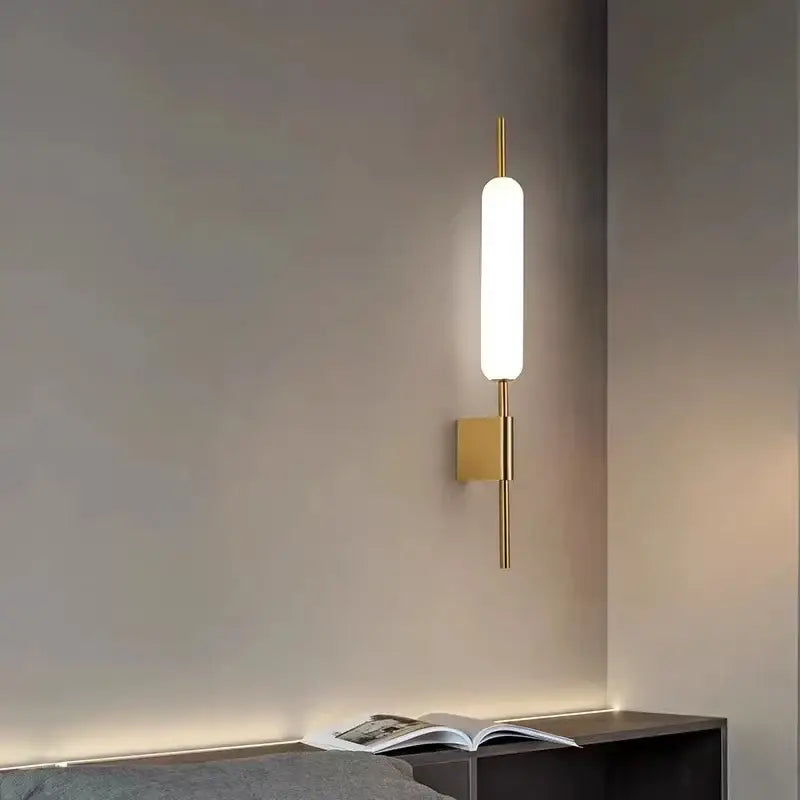 Modern gold led wall light with frosted glass cylinder and minimalist design for bedroom wall light installation