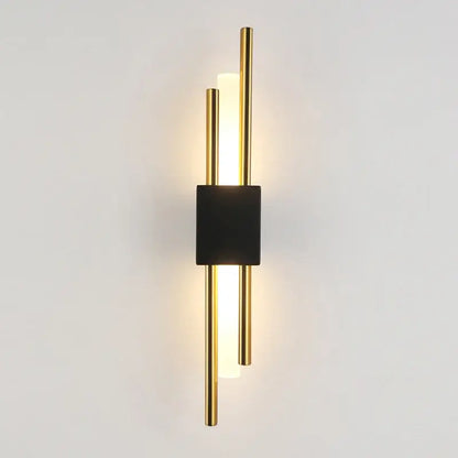 Modern gold led wall sconce with central black square accent and vertical illuminated rods for bedroom ambient lighting