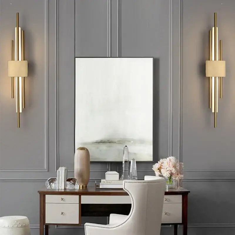 Modern gold led wall sconce with vertical cylindrical rods and cream fabric shades perfect for bedroom decorbites led wall design