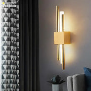 Modern gold led wall sconce with sleek vertical rods and square base ideal for bedroom decorbites led wall lighting