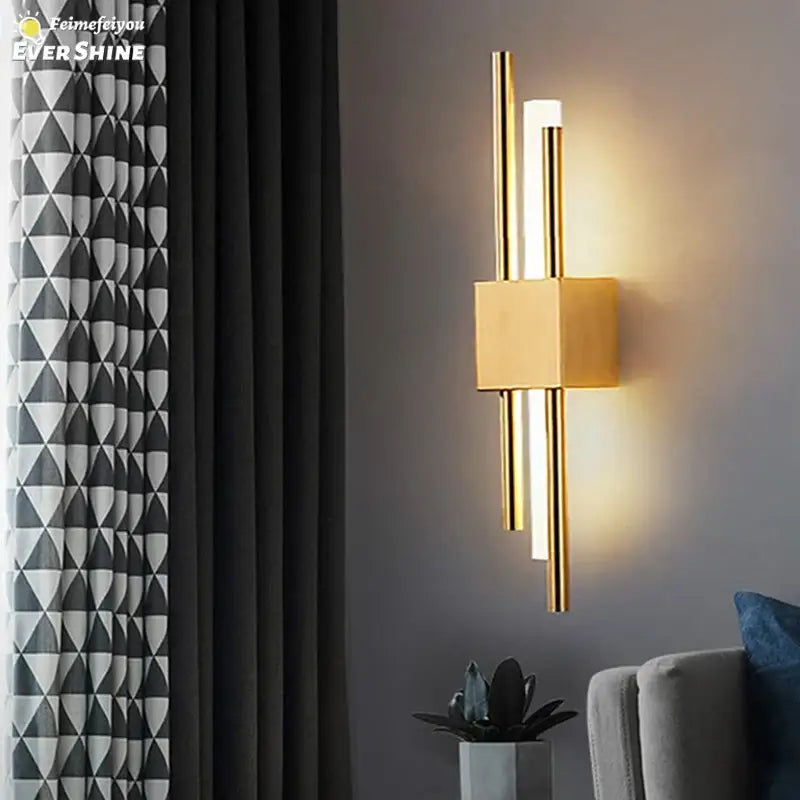 Modern gold led wall sconce with sleek vertical rods and square base ideal for bedroom decorbites led wall lighting
