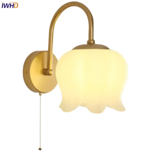 Modern gold led wall sconce with frosted glass bell-shaped shade and arched metal arm for stairway lighting