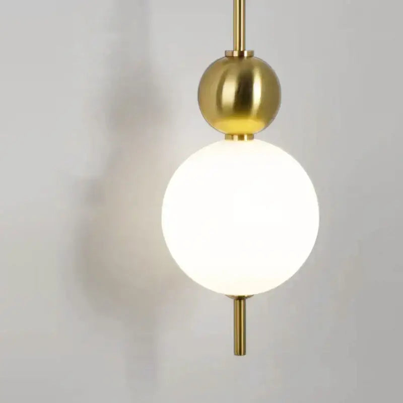 Modern gold led wall sconce with brass-finished spherical pendant and frosted glass globe for bedroom decorbites led wall sconce