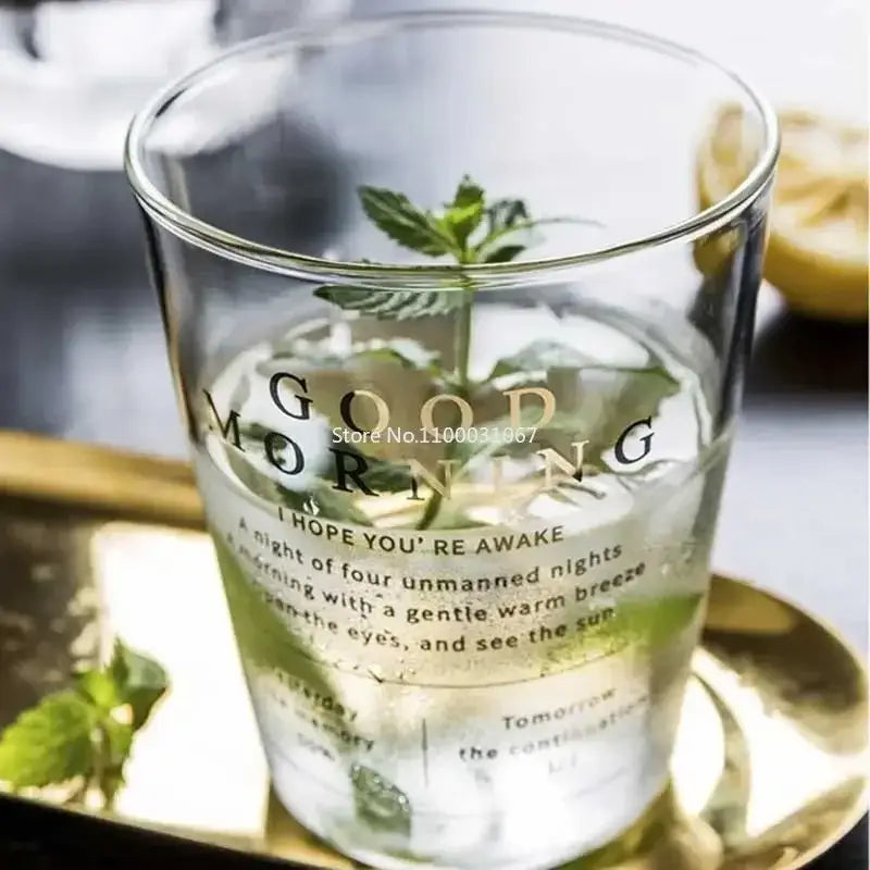 Modern gold letter glass breakfast cup decorbites glass tumbler with good morning print filled with ice and mint leaves