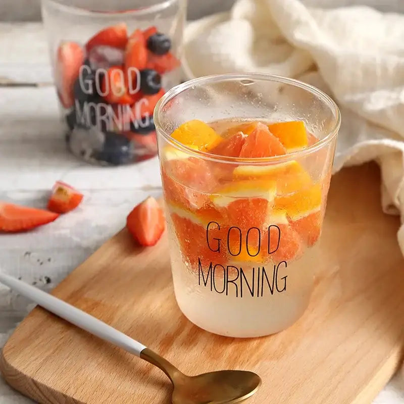 Modern gold letter decorbites glass breakfast cup glass breakfast cup with good morning print filled with orange and strawberry slices