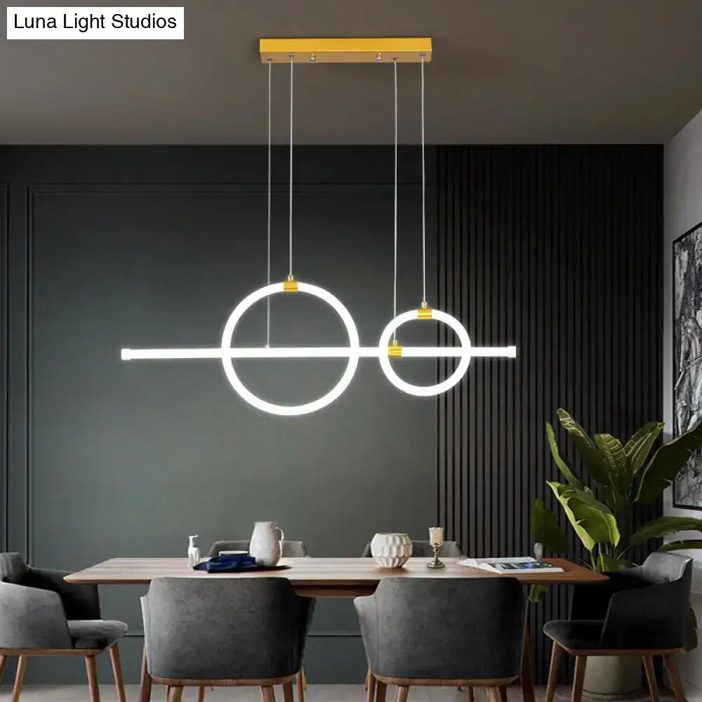 Modern minimalist DecorBites gold linear ring LED island chandelier with yellow mount and glowing white acrylic rings