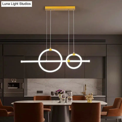 Modern minimalist gold linear pendant light with two glowing ring led circles and acrylic design for dining room
