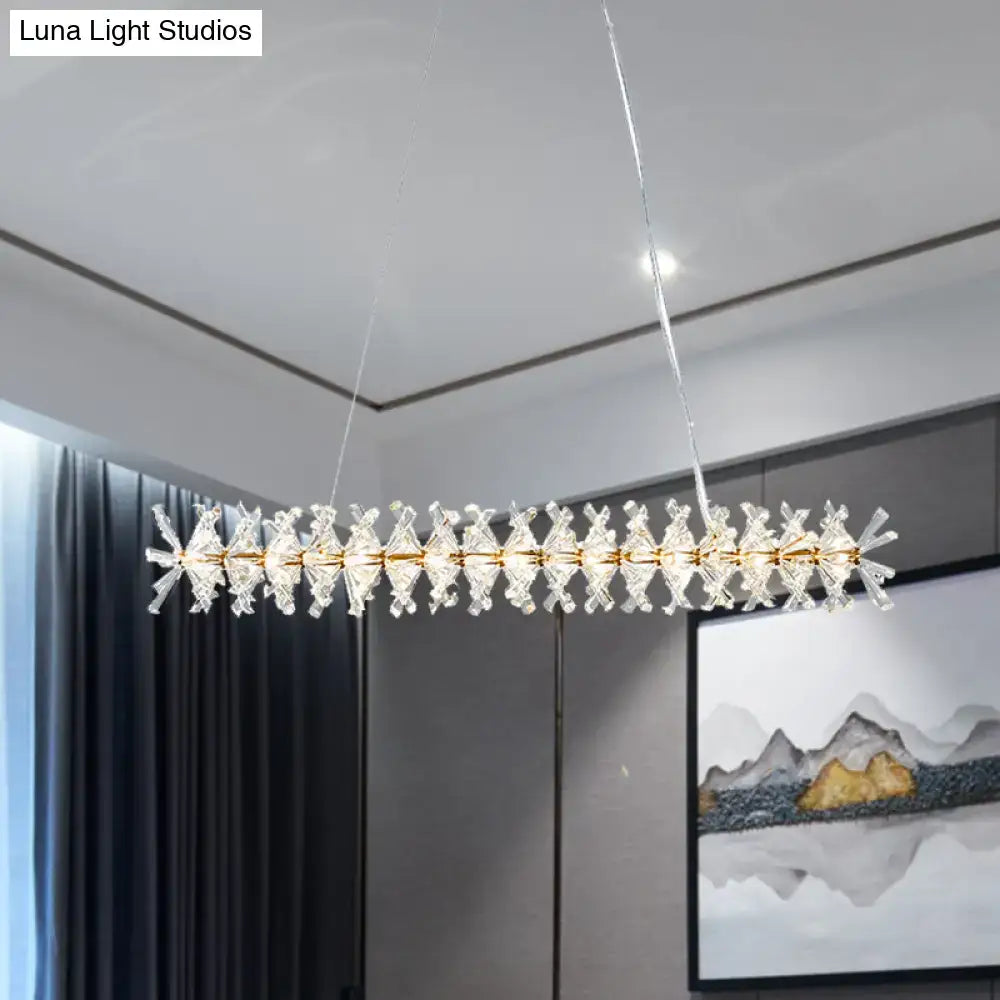 Modern gold linear crystal island lamp with starburst prisms and gold-toned frame for living room fixture width