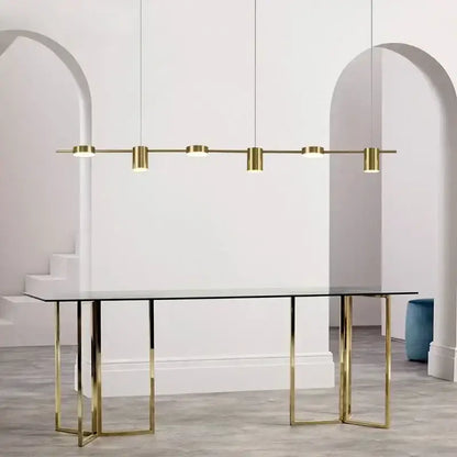 Modern gold linear dimmable led ceiling chandelier with five cylindrical bulbs above glass-top table decorbites dimmable led
