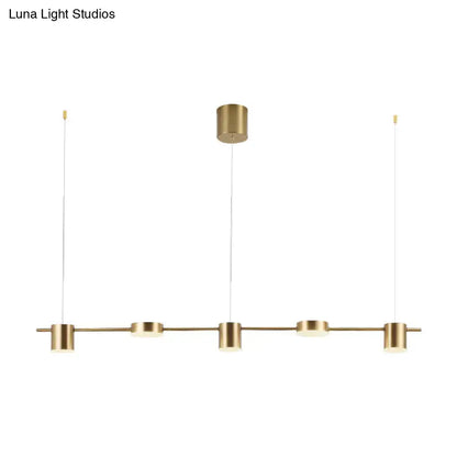 Modern gold linear shaped led pendant light with brass finish and four cylindrical bulbs for dining room use