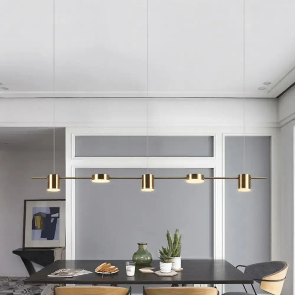 Modern gold linear shaped led pendant light with five cylindrical bulbs for dining room illumination