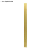 Modern gold linear led wall light fixture with sleek metal strip and subtle vertical line detail for living room sconce