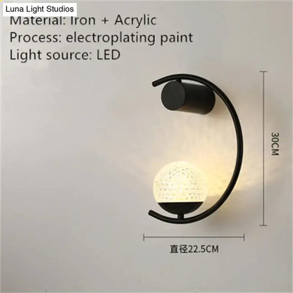 Black iron and acrylic luxury creative led bedside wall sconce with curved arm and illuminated textured globe