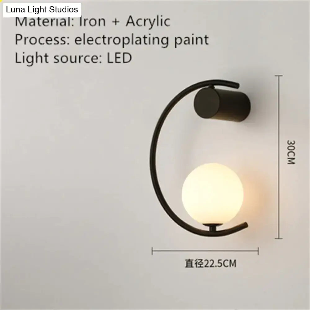 Modern black iron and acrylic led bedside wall sconce with frosted globe for luxury creative led bedroom lighting