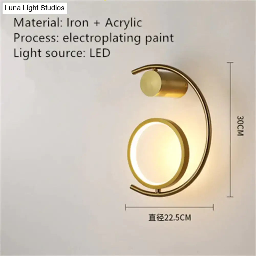 Gold-toned crescent led bedside wall sconce with circular acrylic diffuser and iron frame for luxury creative led lighting