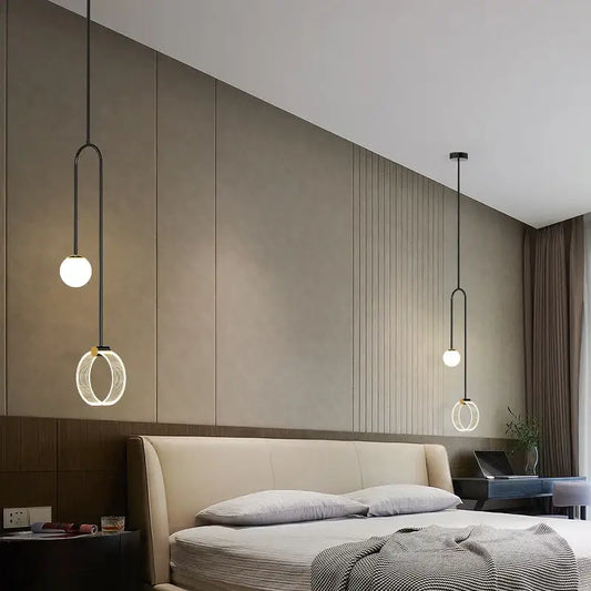 Modern black pendant light with spherical bulbs and circular rings complements decorbites gold luxury led bedroom art
