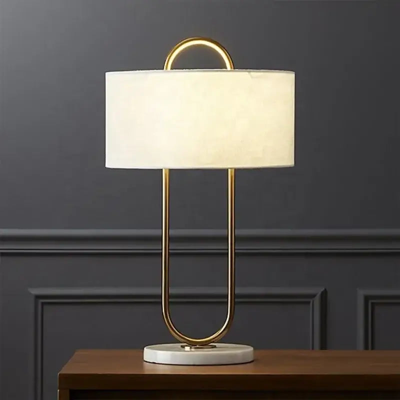 Modern gold luxury led table lamp with gold-toned paperclip design white fabric shade and marble base for decorbites gold luxury
