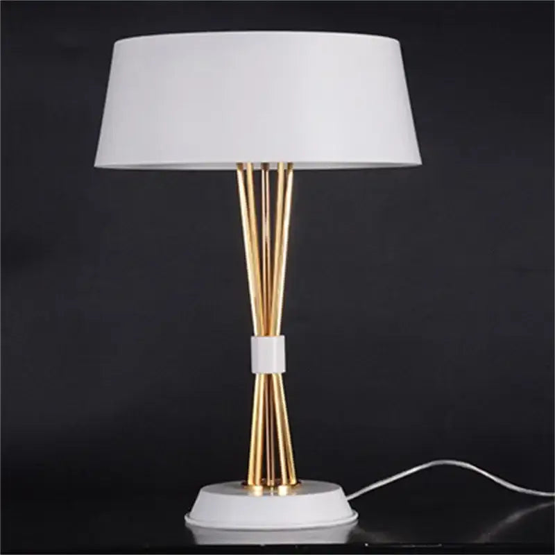 Modern gold luxury led table lamp with white fabric shade, gold metal rods, and circular marble base for bedroom decorbites gold luxury