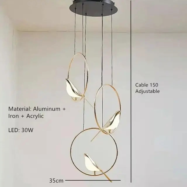 Modern gold magpie bird ceiling chandelier with three gold-toned circular frames and bird-shaped led lamps suspended by cables