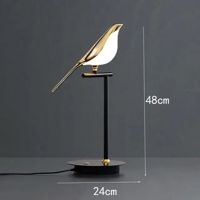 Modern gold magpie bird ceiling chandelier featuring a gold-toned bird-shaped table lamp with black metal stand decorbites gold magpie