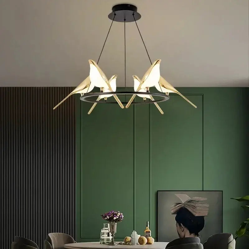 Modern gold magpie bird led chandelier with sleek gold-toned illuminated wings for dining room decorbites gold magpie lighting