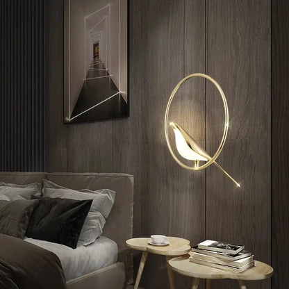 Modern gold magpie bird led ring chandelier features a gold-toned bird-shaped wall sconce with glowing interior light