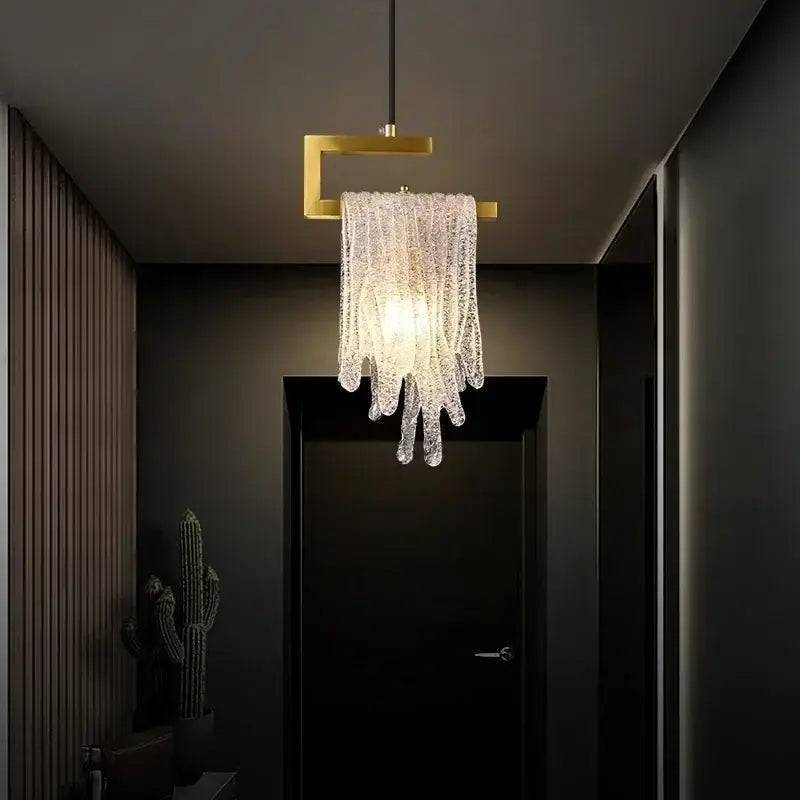 A modern gold melting ice crystal led pendant light with glass strands and a gold-toned square frame decorbites crystal led decor