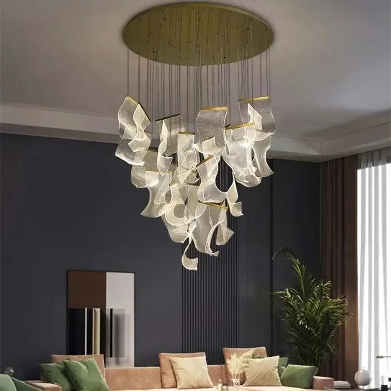 Modern gold mesh duplex building chandelier with flowing white mesh elements suspended from a circular brass base