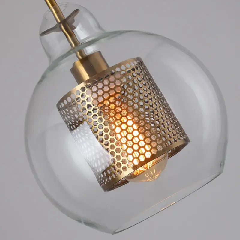 Modern gold mesh glass ball pendant light with clear glass globe and brass honeycomb shade for kitchen dining room decorbites pendant light