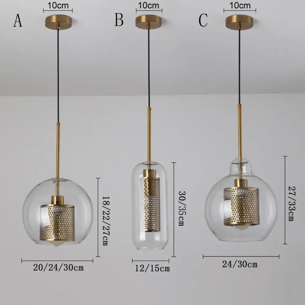 Three modern brass-finished decorbites glass ball pendant lights with clear glass globes and textured shades for kitchen dining room