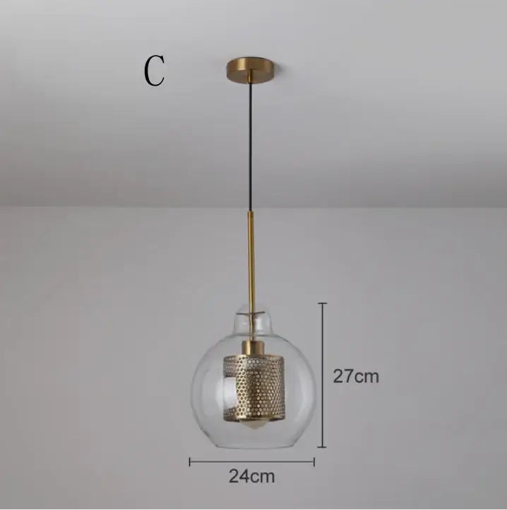 Modern gold mesh glass ball pendant light with clear globe and brass accents for kitchen or dining room decorbites glass ball