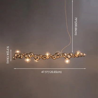 Modern gold metal arched ceiling light with six exposed bulbs and glass orbs for dining room illumination