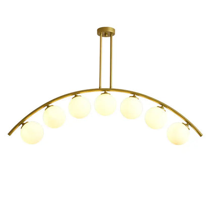Modern gold metal arched ceiling light fixture with six frosted glass bulbs for dining room use