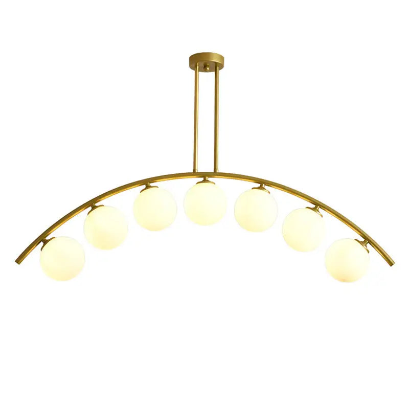 Modern gold metal arched ceiling light fixture with six frosted glass bulbs for dining room use
