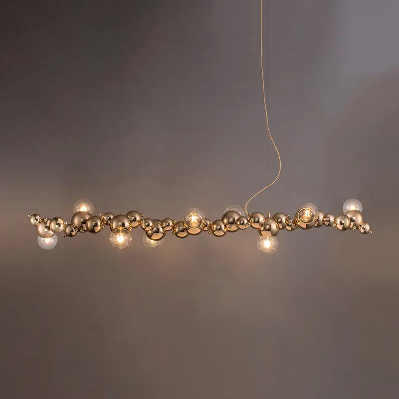 Modern gold metal arched ceiling light with six spherical bulbs for elegant dining room illumination