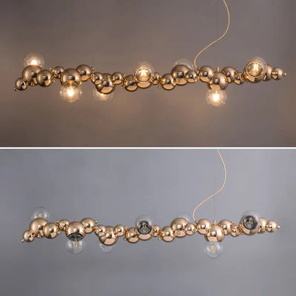 Modern gold metal arched ceiling light with six clear glass bulbs for dining room featuring a sleek spherical design