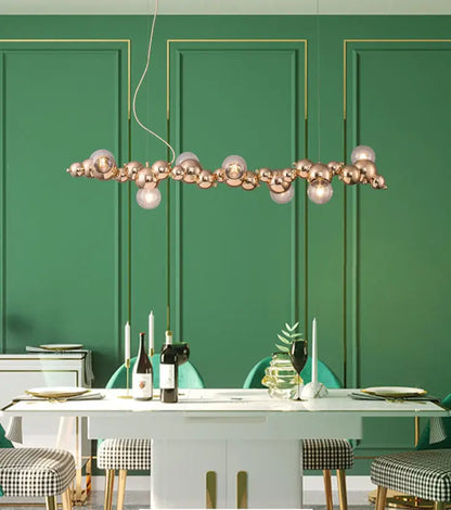 Modern gold metal arched ceiling light with six rose gold spherical bulbs for elegant dining room ambiance