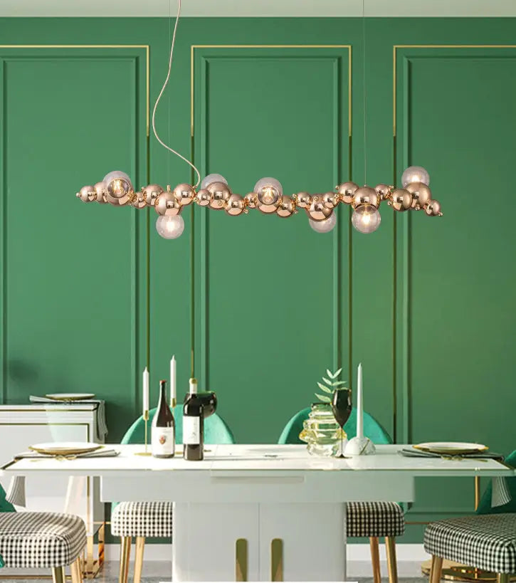 Modern gold metal arched ceiling light with six rose gold spherical bulbs for elegant dining room ambiance