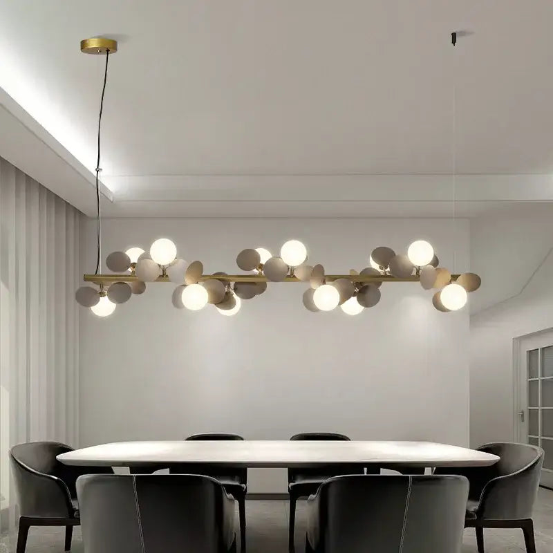 Modern gold metal branching pendant light with spherical bulbs in white gray and beige for dining room decorbites gold metal