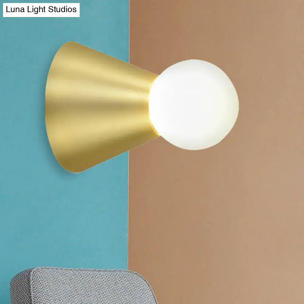 Modern gold metal conical sconce wall light with frosted globe bulb for bedroom lighting