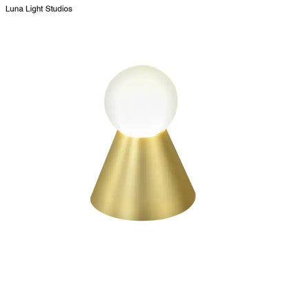 Modern gold metal conical sconce wall light with frosted globe and polished brass base for bedroom use