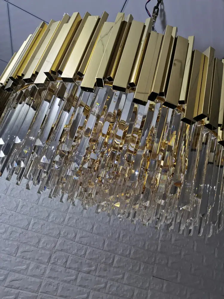 Modern gold metal crystal chandelier with clear crystal prisms and geometric bars for dining room decorbites gold metal