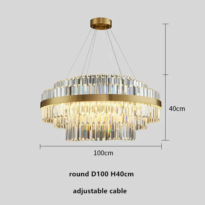 Modern gold metal crystal pendant light with a round frame and clear prisms hanging from an adjustable cable