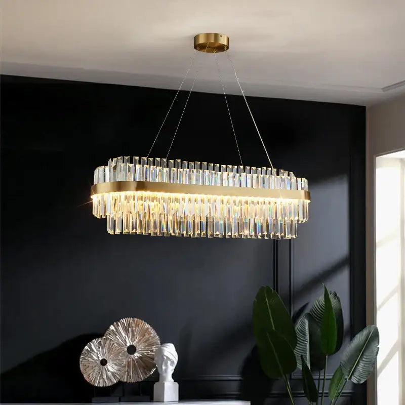 Modern gold metal crystal pendant light with rectangular frame and cascading rods for dining room decorbites gold metal