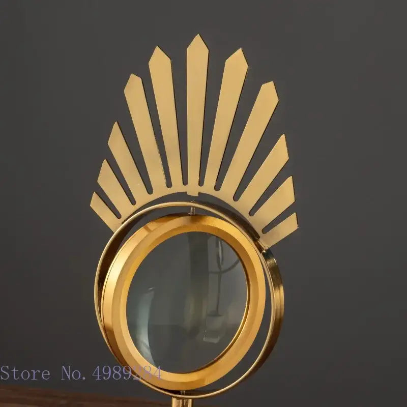 Modern gold metal magnifying glass with sunburst design and glass base for stylish living room decor by decorbites golden metal