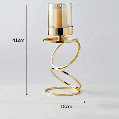 Modern gold metal frame glass candle holder with gold-toned spiral metal and beige pillar candle for dining room decorbites gold metal decor